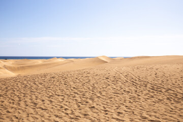 sand hills near Atlantic ocean against clear blue sky in Maspalomas, Gran Canaria