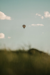 hot air balloon in the air in the sunset