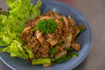 Thai food, minced pork stir-fried with onion
