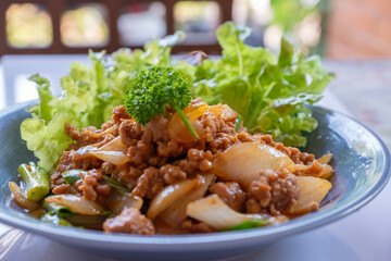 Thai food, minced pork stir-fried with onion
