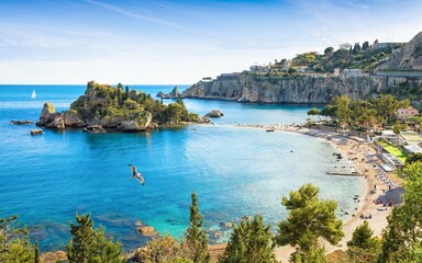 Beautiful Isola Bella, small island near Taormina, Sicily, Italy. Narrow path connects island to...