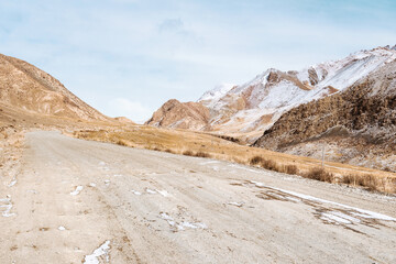 the gravel road on the snow mountain