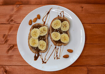 healthy dessert with chocolate paste and bananas