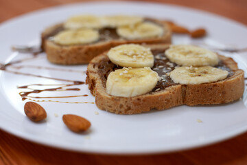 healthy dessert with chocolate paste and bananas