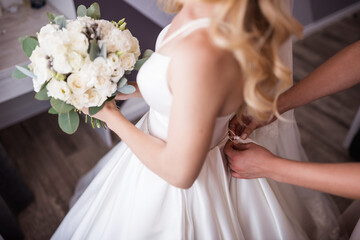 Bride in a white dress with a bouquet
