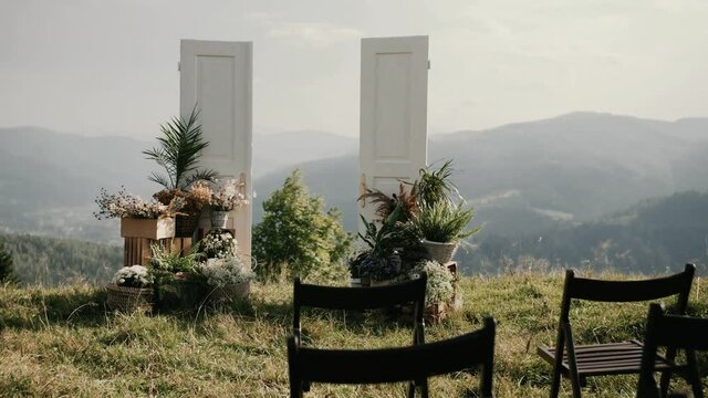 Beautiful wedding arch in the mountains, doors to heaven, doors to the sky