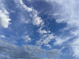 Slight clouds in blue sky, low angle view.  Rainy season, clouds and sky in rainy season.