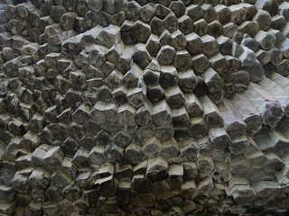 Close up view from bottom upwards on the textures of the basalt columns of the gorge Garni, known...