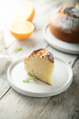 Homemade orange cake on a white plate