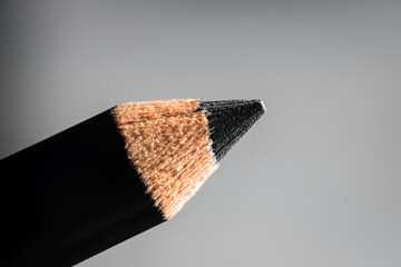 A macro shot of a black pencil tip. Kept in a white background