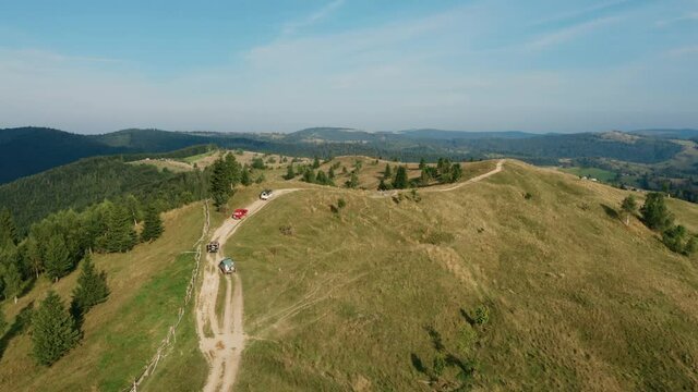Beautiful mountain landscape with off-road driving, several jeeps go off-road