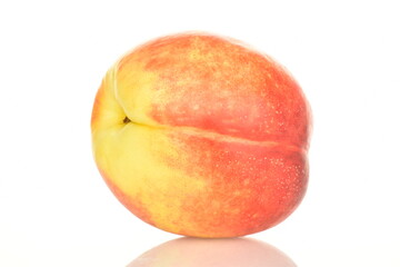 Ripe juicy organic nectarine, macro, on a white background.