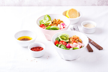 Fresh salad with couscous, tomatoes, cucumber, radish and chard.