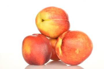 Ripe juicy organic nectarine, macro, on a white background.