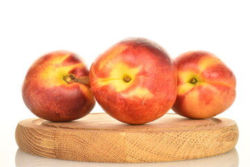Ripe juicy organic nectarine, macro, on a white background.