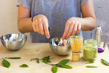 unrecognizable Girl prepared Matcha Latte Tea at home. Healthy lifestyle. Health care. Superfood.