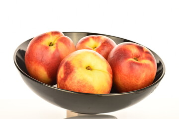 Ripe juicy organic nectarine, macro, on a white background.