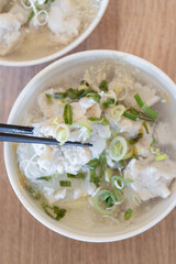 Delicious fish ball rice noodles in thick soup, common food in Tainan, Taiwan, Asia, Asian Taiwanese street delicacy cuisine, close up, lifestyle.