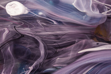 Macro shot of petriart - a technique of modern painting. Alcoholic ink is dripped into the epoxy resin. The resulting frame at the same time resembles both the sea depths and distant galaxies.