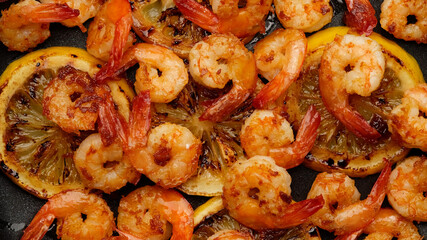 fried shrimps with lemon top view macro