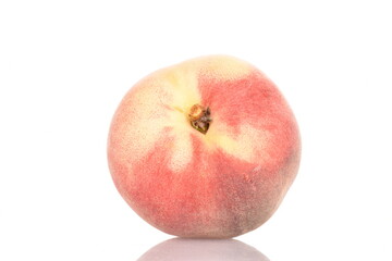Ripe organic peach, close-up, on a white background