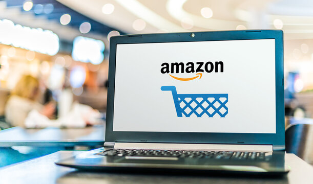 Laptop computer displaying logo of Amazon