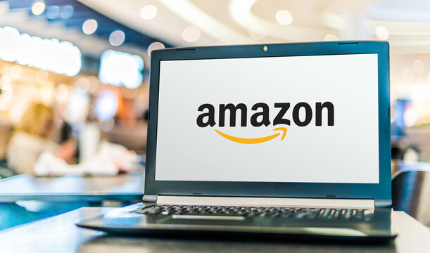 Laptop computer displaying logo of Amazon