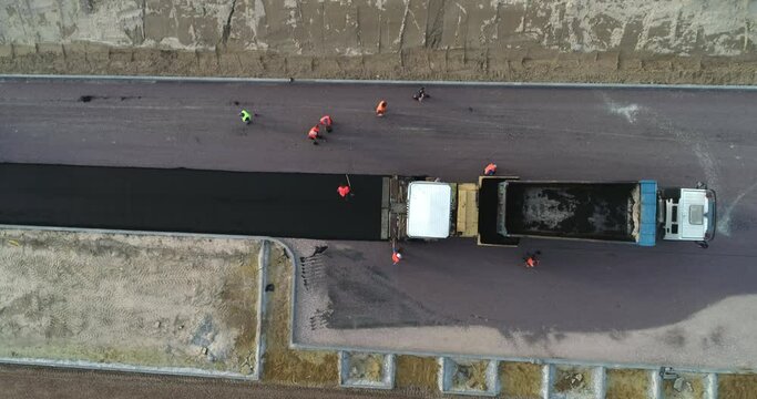 Top View of an Asphalt Road Getting Done By the Workers