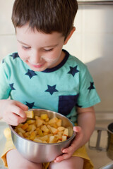 Apple pie preparation, kid making cake
