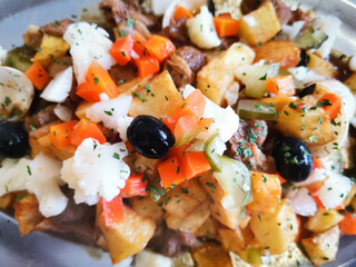 tasty beef steak kabobs with vegetables on a slate plate