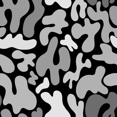 Abstract pattern of white and gray spots on a black background.A simple pattern of spots.Abstract style.Vector