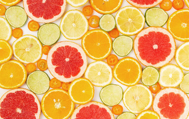 Fototapeta na wymiar Various citrus fruits slices pattern on white background.