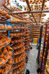 Persimmons ripe in the autumn season and production process