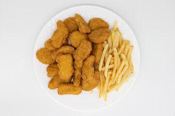 Chicken Nuggets and French Fries on a White Plate with a White Background