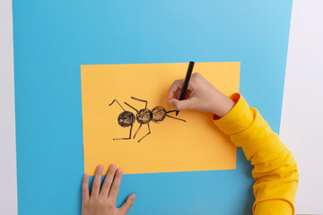 How to draw an ant, an easy art project for a preschooler, DIY, step 2, add line legs and antennas