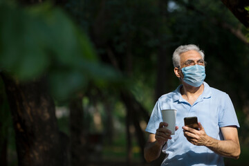 Senior man using mobile phone