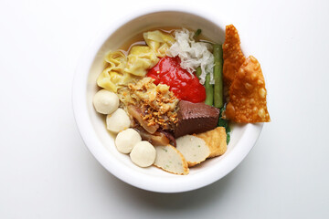 Close up Yentafo Noodles Served in a white circular bowl Put on the white table Ready to eat