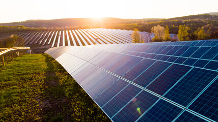 Solar panels (solar cell) in solar farm with sun lighting to create the clean electric power - obrazy, fototapety, plakaty
