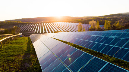 Solar panels (solar cell) in solar farm with sun lighting to create the clean electric power - obrazy, fototapety, plakaty