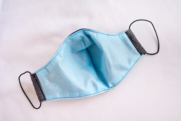 Inner part of a protective mask made of fabric, with TNT material for protection against the covid-19 pandemic, isolated on a white background.