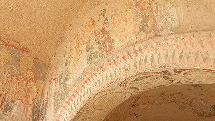 Cappadocia cone-shaped rock formations near the city of Göreme with snow during winter in central...