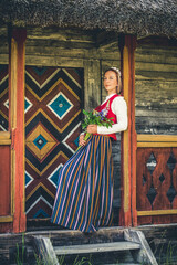 Latvian woman in traditional clothing. Ligo folk.
