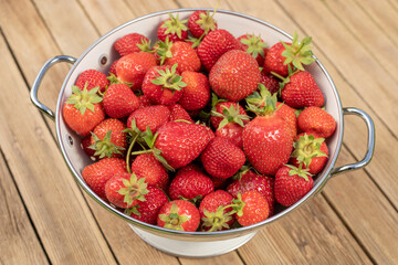 Strawberry in a Bowl on wooden background