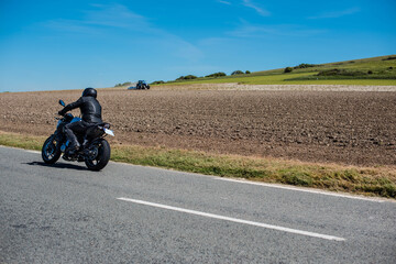 Fototapeta na wymiar biker traveling at high speed on a country road