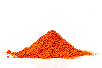 Pile of red paprika powder isolated on white background, top view