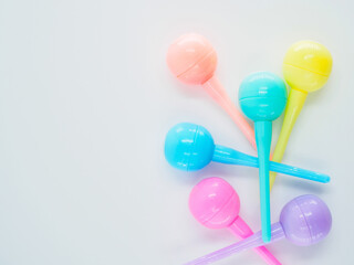 Flat lay, a scattering of markers in pastel colors at the white background with place for text