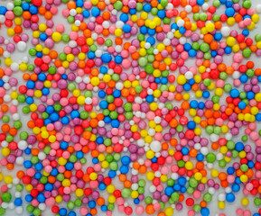 Fototapeta na wymiar Background texture of multicolored foam balls