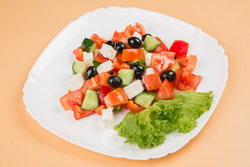 
Greek salad. Fresh salad. Greek salad in a white plate