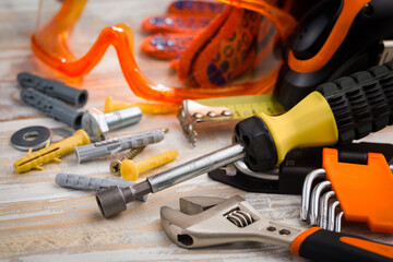 A home craftsman's tool for repairing household appliances and equipment. Arranged in a composition on old boards.