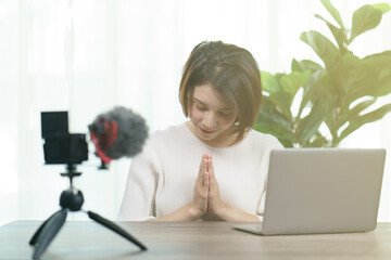 Female blogger recording broadcast video at home, Fashion, makeup, technology concept
